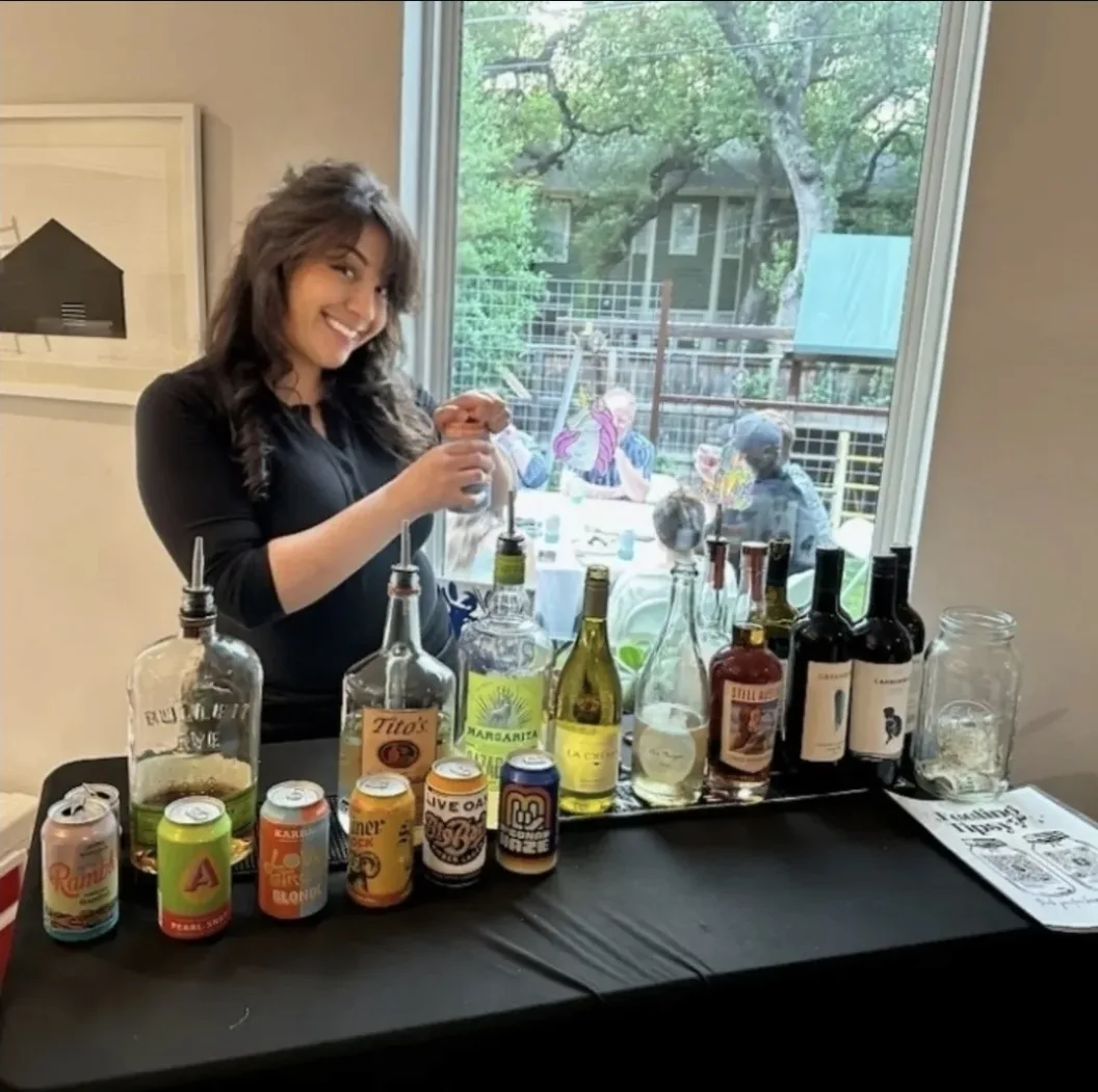 Professional Bar Divas of Austin bartender working behind an organized event bar